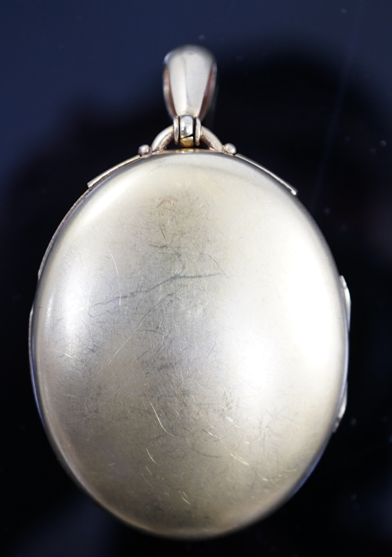 A Victorian gold, diamond and split pearl set oval locket